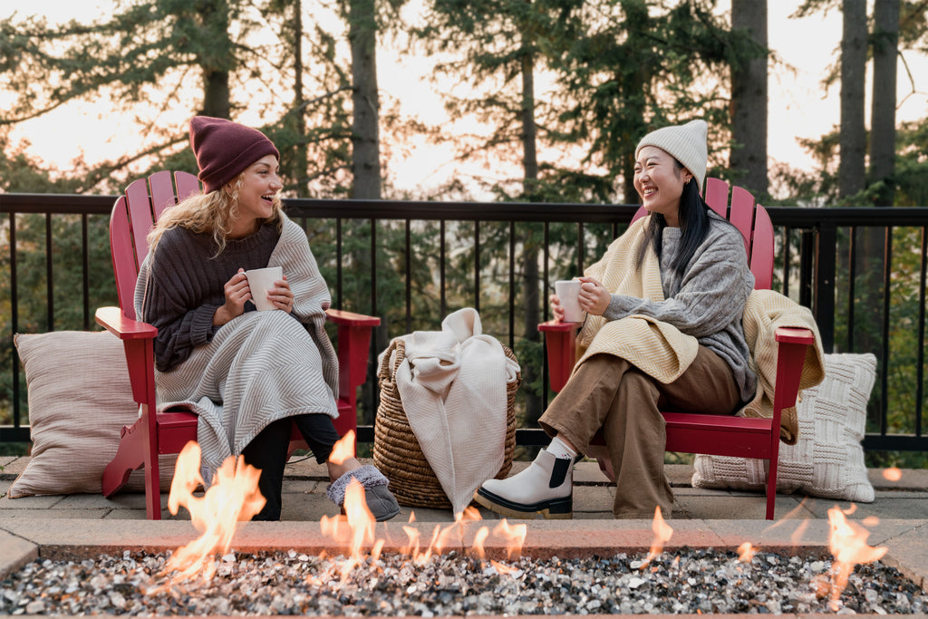 Two women relaxing with Heritage Blankets.