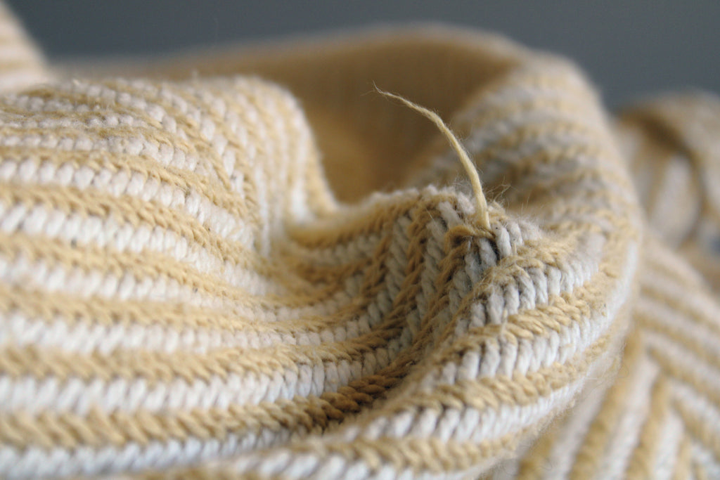 Prairie yellow cotton made in usa heritage blanket with a broken thread, here's how to fix it.