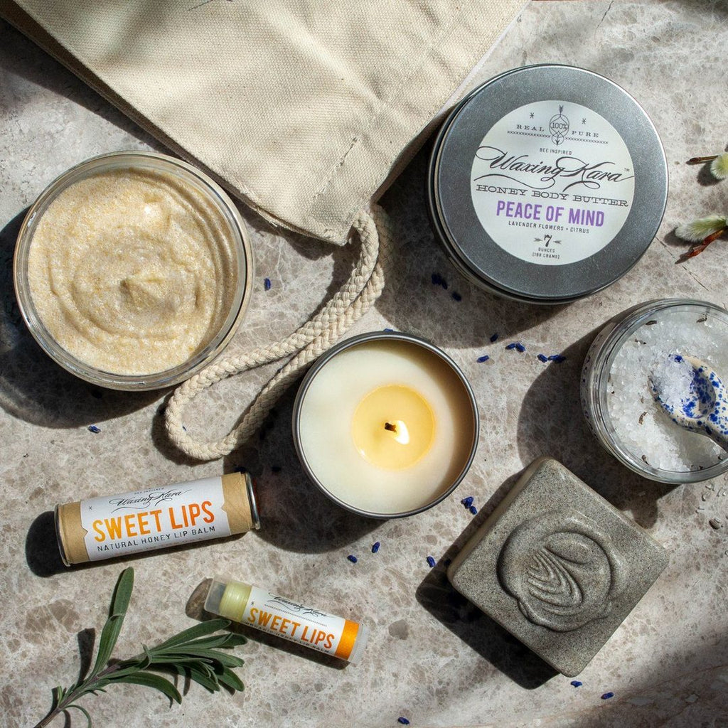 Waxing Kara Made in USA Gift Set, featuring Peace of Mind Body Scrub + Body Butter, Lavender Pumice Honey Soap, Sweet Lips Honey Lip Balm, and a Peace on Earth Candle